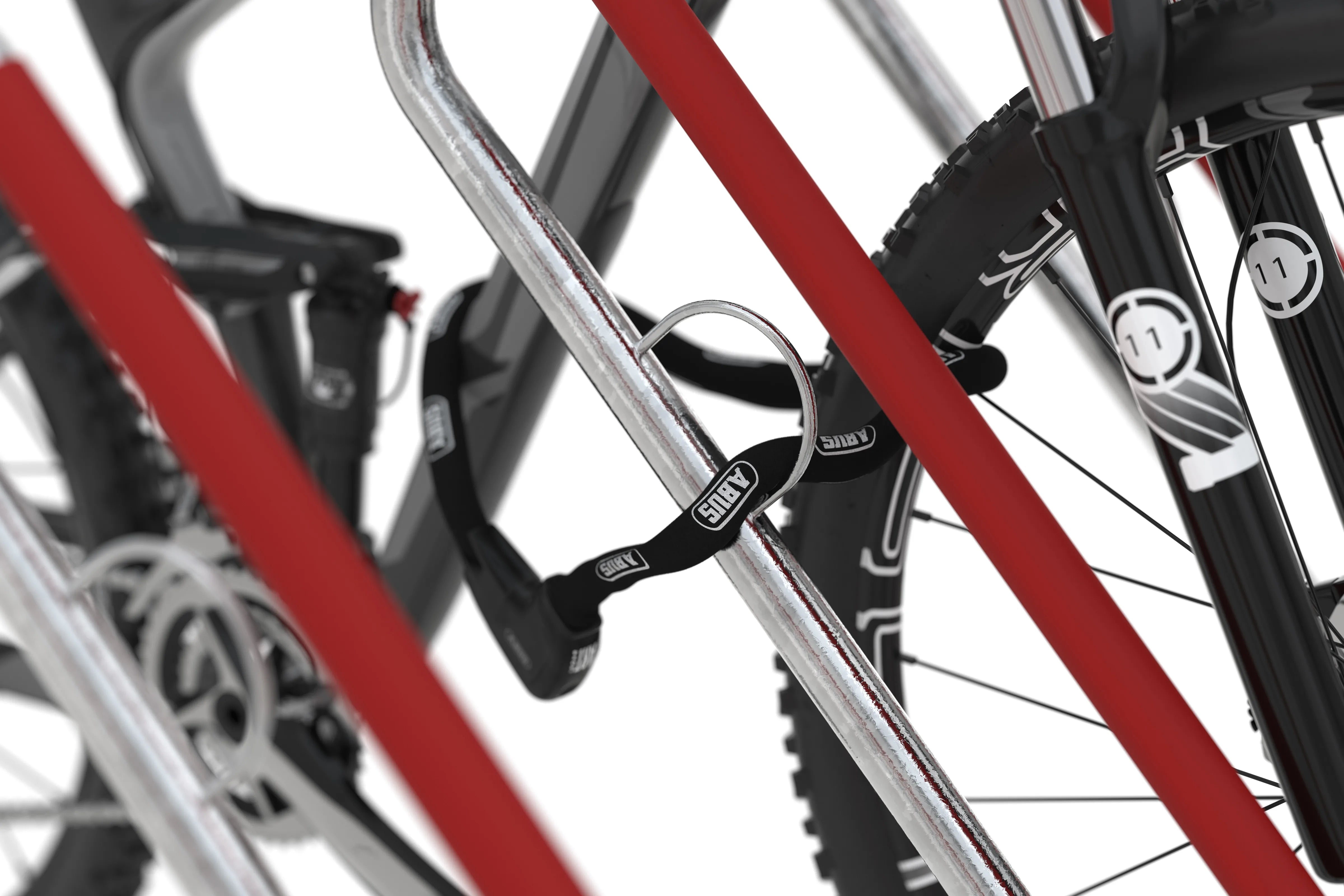 Detailansicht Fahrradparksystem aus Metall mit Fahrrad und Bügelschloss, rot-silber