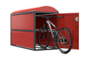 Rote Fahrradbox aus Metall mit offenem Türflügel, darin ein Mountainbike