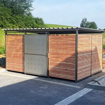 Zu Fahrradhäusern, Fahrradgaragen und Mülltonnenhäusern