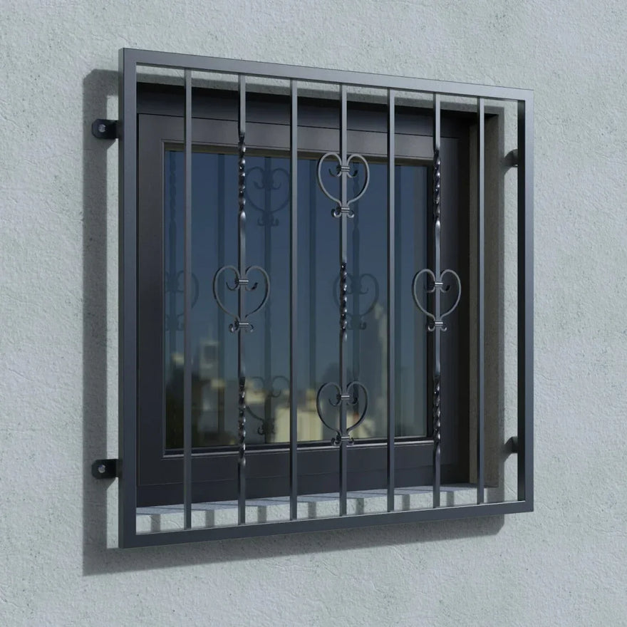 Fenstergitter RAL 7016 anthrazit mit Herz-Ornamenten an Hauswand montiert
