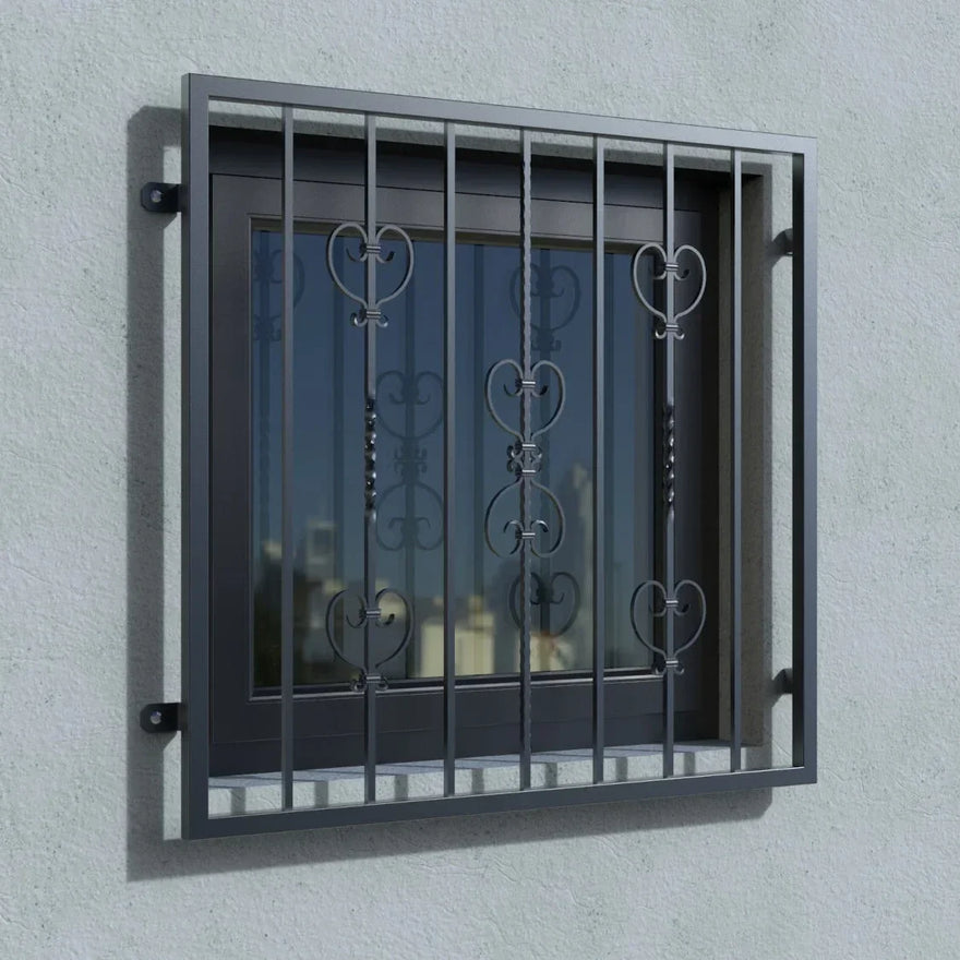 Fenstergitter aus Metall in Anthrazit RAL 7016 mit dekorativen Ornamenten an einer Hauswand