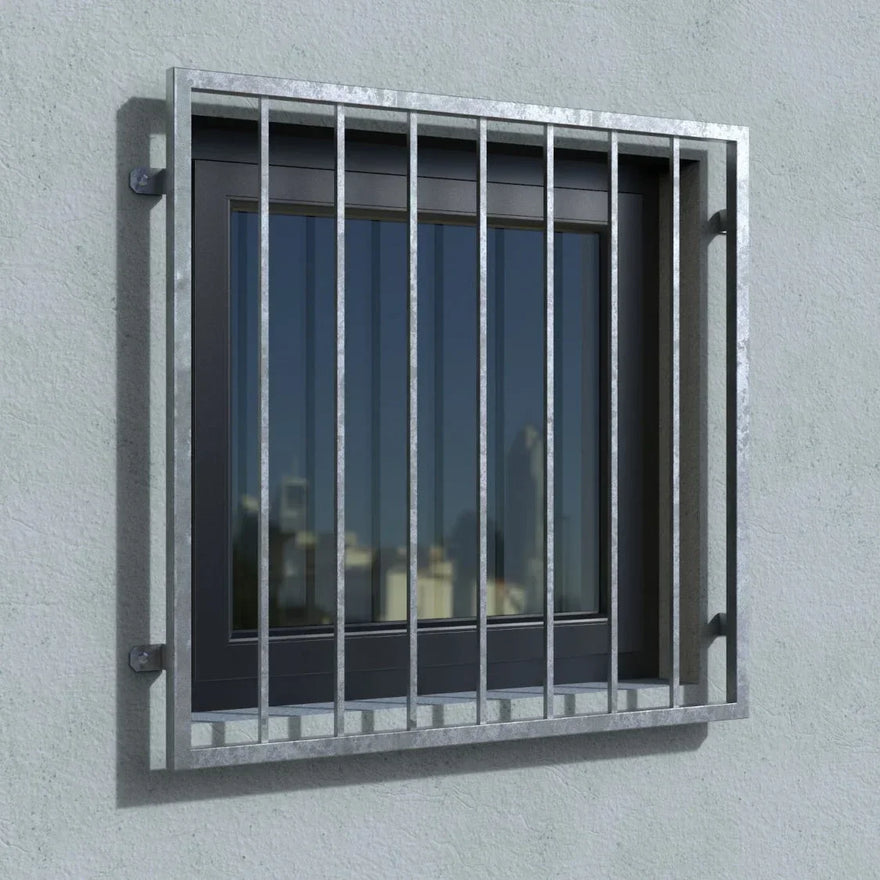 Verzinktes Fenstergitter aus Metall montiert an einer hellen Außenwand